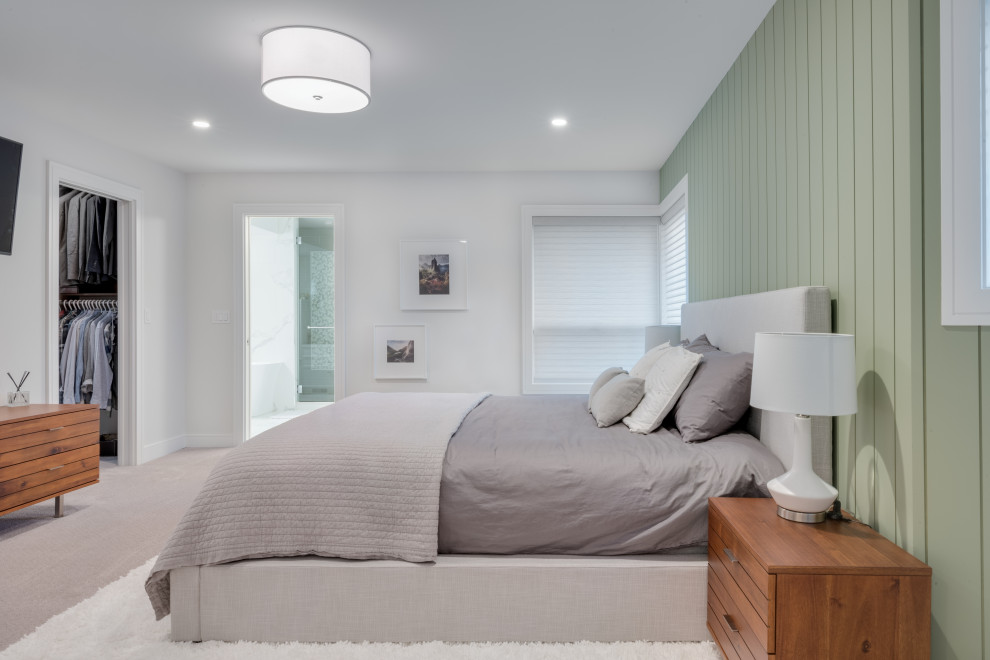 Large trendy master carpeted, gray floor and shiplap wall bedroom photo in Vancouver with green walls