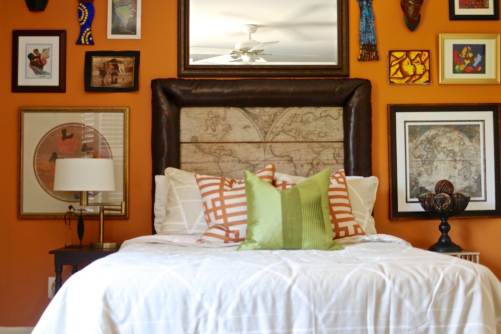 Idées déco pour une chambre éclectique avec un mur orange.