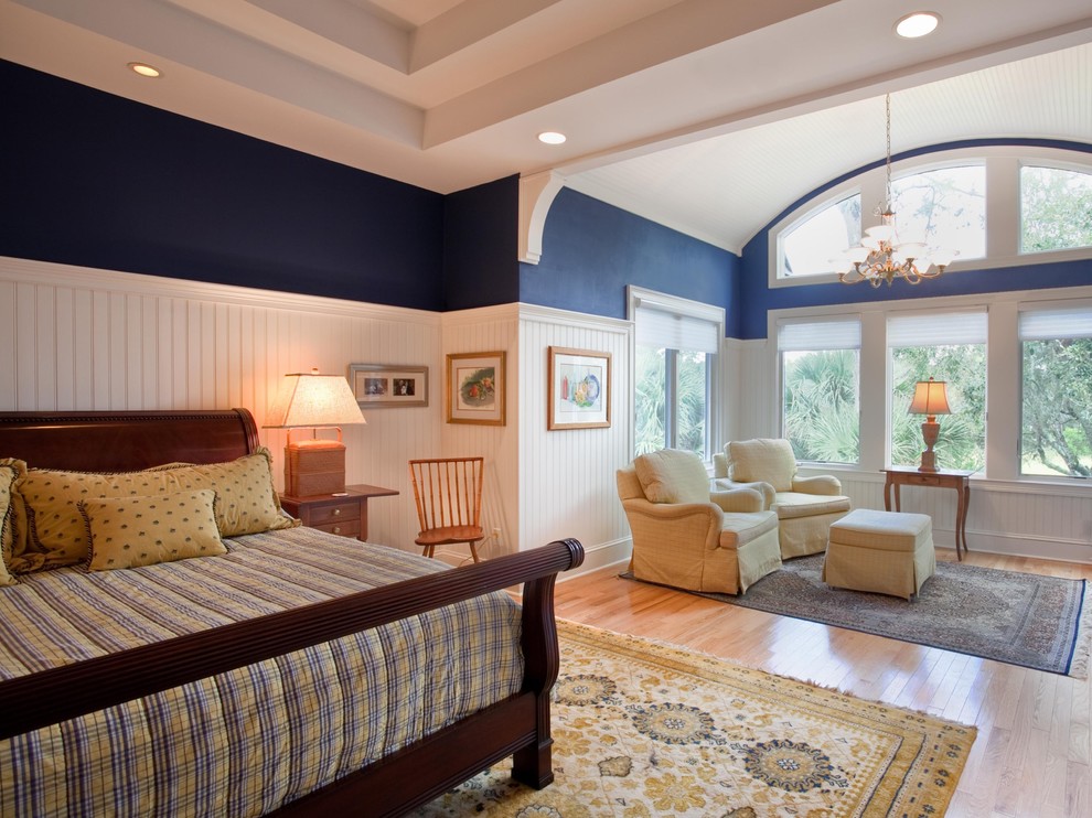 Bedroom - large traditional master medium tone wood floor bedroom idea in Charleston with blue walls