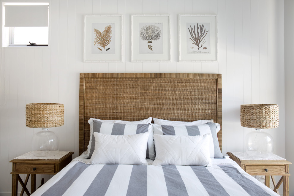 Mid-sized beach style bedroom photo in Brisbane with white walls