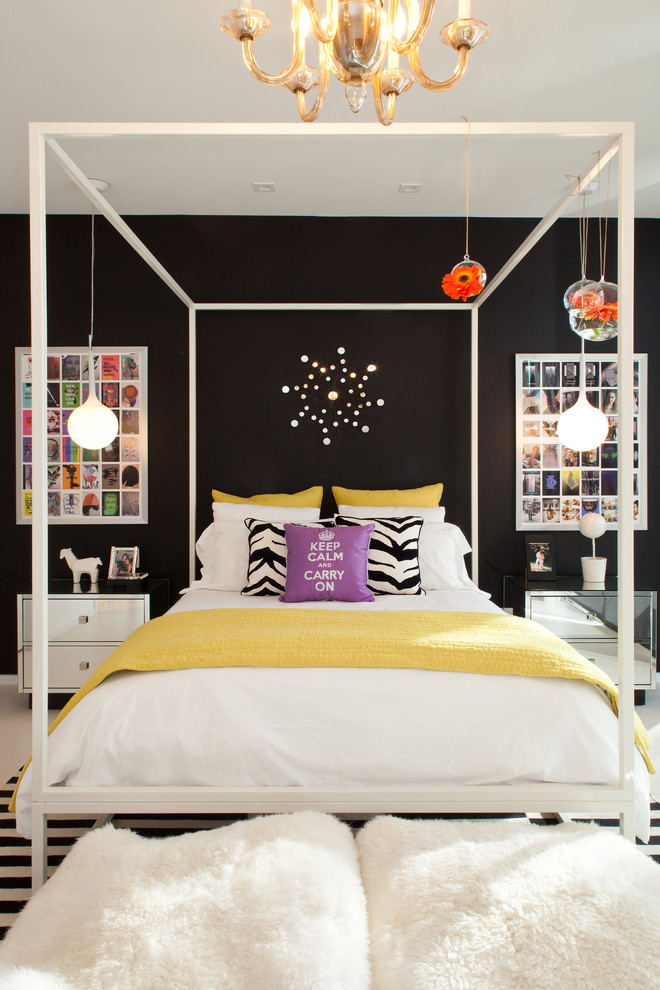 Photo of a large contemporary bedroom in Miami with black walls and no fireplace.