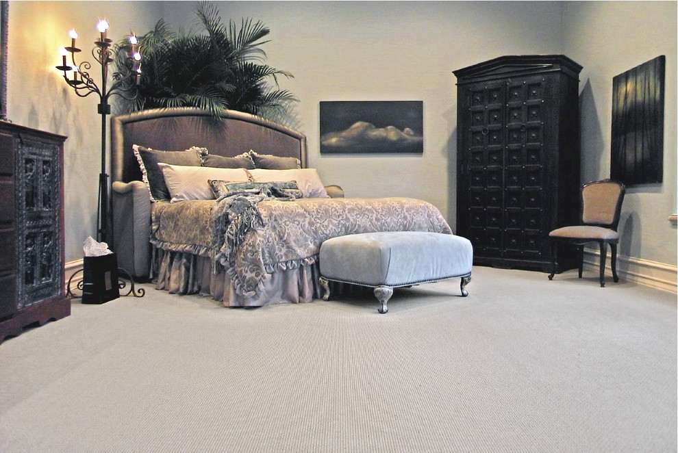 This is an example of a classic bedroom in Houston with carpet.