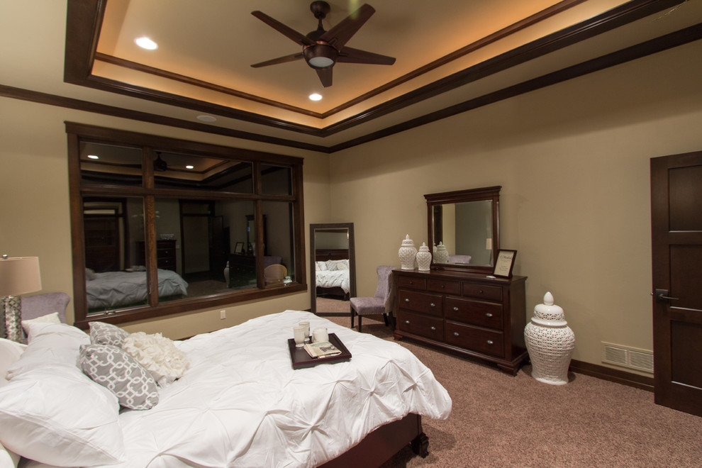 Inspiration for a transitional carpeted bedroom remodel in Milwaukee with beige walls