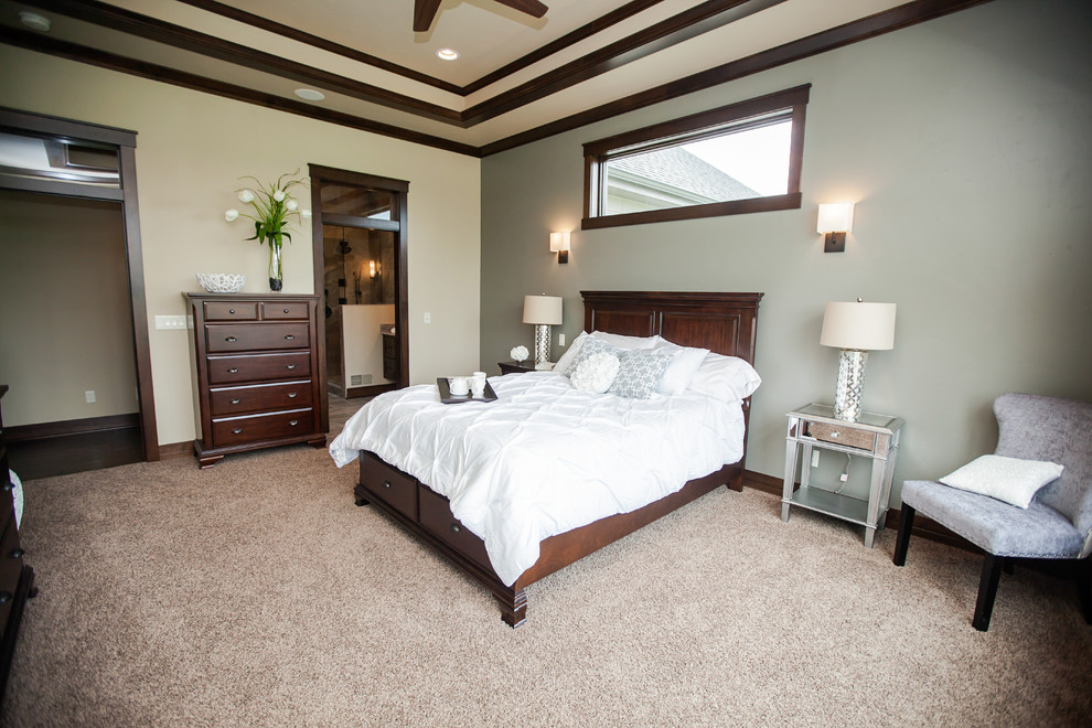 Example of a transitional carpeted bedroom design in Milwaukee with beige walls