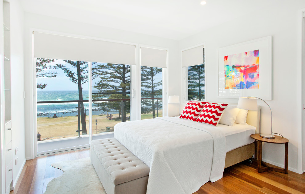 Example of a beach style bedroom design in Gold Coast - Tweed
