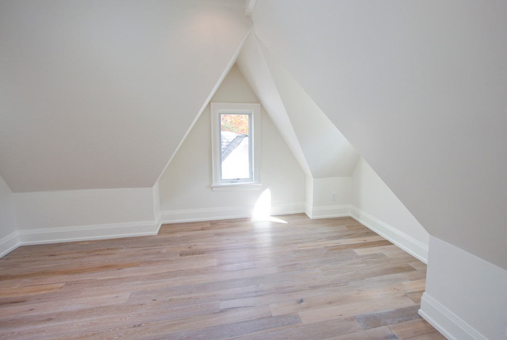 Inspiration for a medium sized traditional guest bedroom in Toronto with white walls and light hardwood flooring.