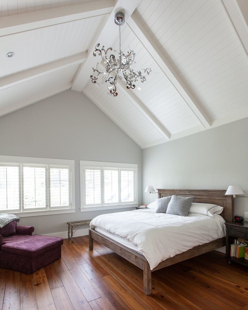 Large elegant master dark wood floor bedroom photo in Vancouver with gray walls