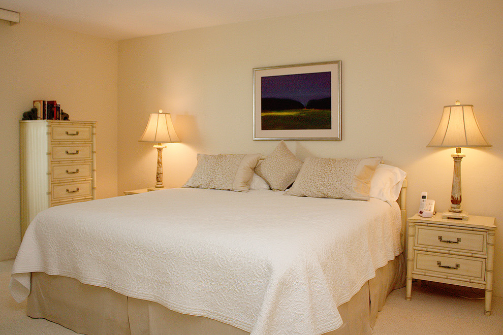 Example of a mid-sized classic guest carpeted bedroom design in Tampa with white walls and no fireplace