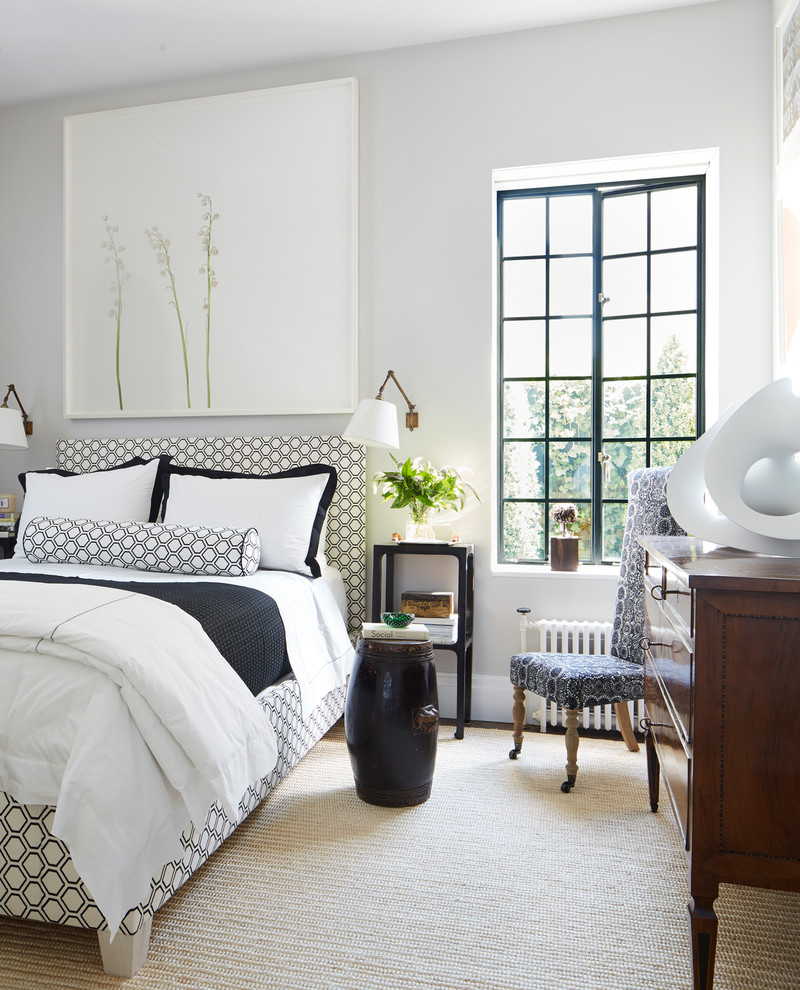 Inspiration for a contemporary master bedroom remodel in New York with white walls