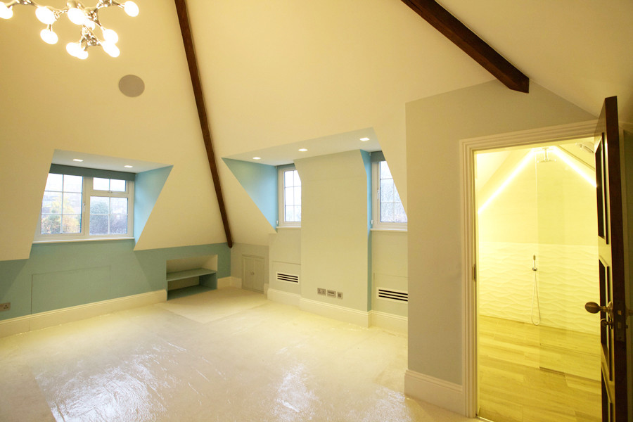 Example of a large trendy guest carpeted bedroom design in London with no fireplace and white walls