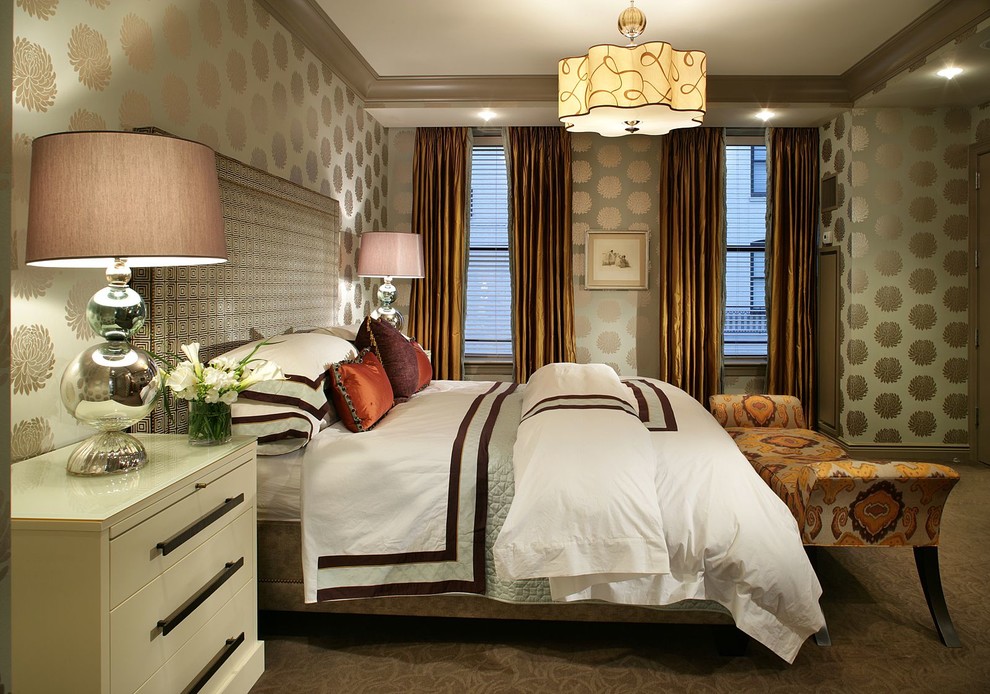 This is an example of a contemporary grey and brown bedroom in New York with green walls and carpet.