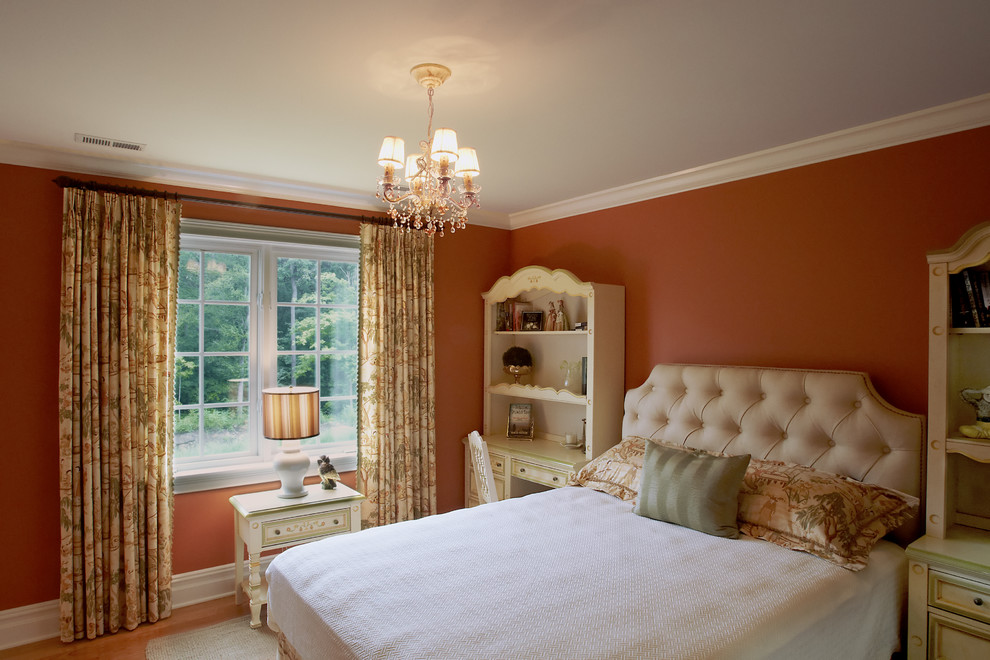 Classic bedroom in New York with orange walls.