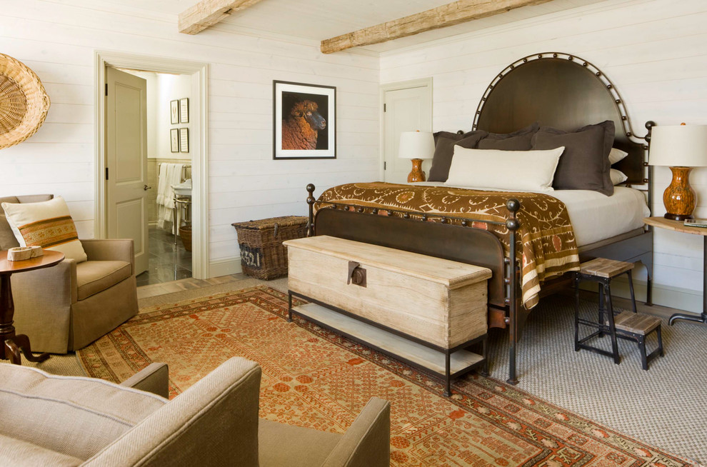 This is an example of a rustic bedroom in Denver with beige walls and carpet.