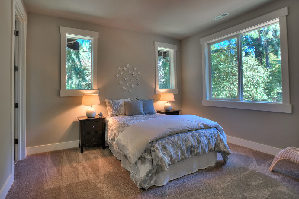This is an example of a medium sized classic guest bedroom in Seattle with grey walls and carpet.
