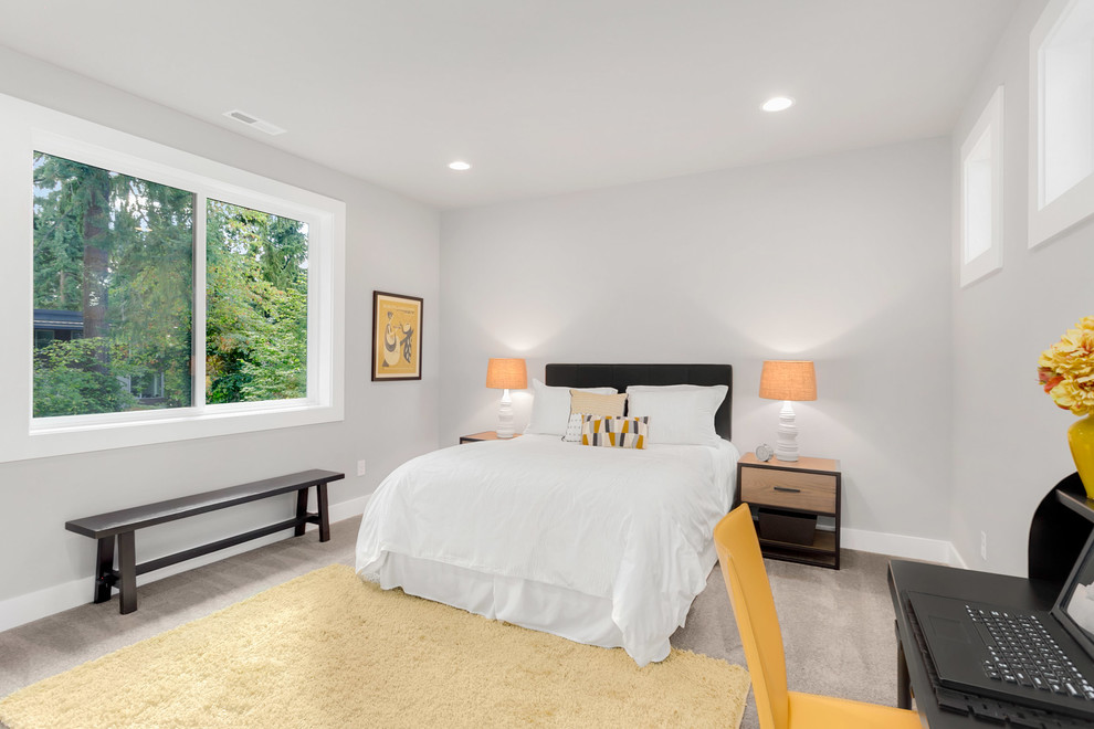 Ejemplo de habitación de invitados actual de tamaño medio con paredes grises, moqueta y suelo gris