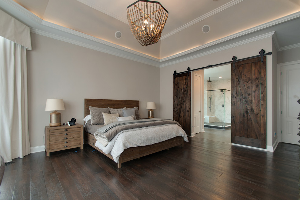 Bedroom - large transitional master dark wood floor and brown floor bedroom idea in Nashville with gray walls and no fireplace