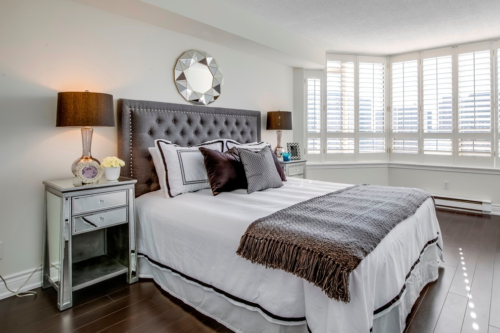 This is an example of a small classic master and grey and brown bedroom in Toronto with grey walls, dark hardwood flooring and brown floors.