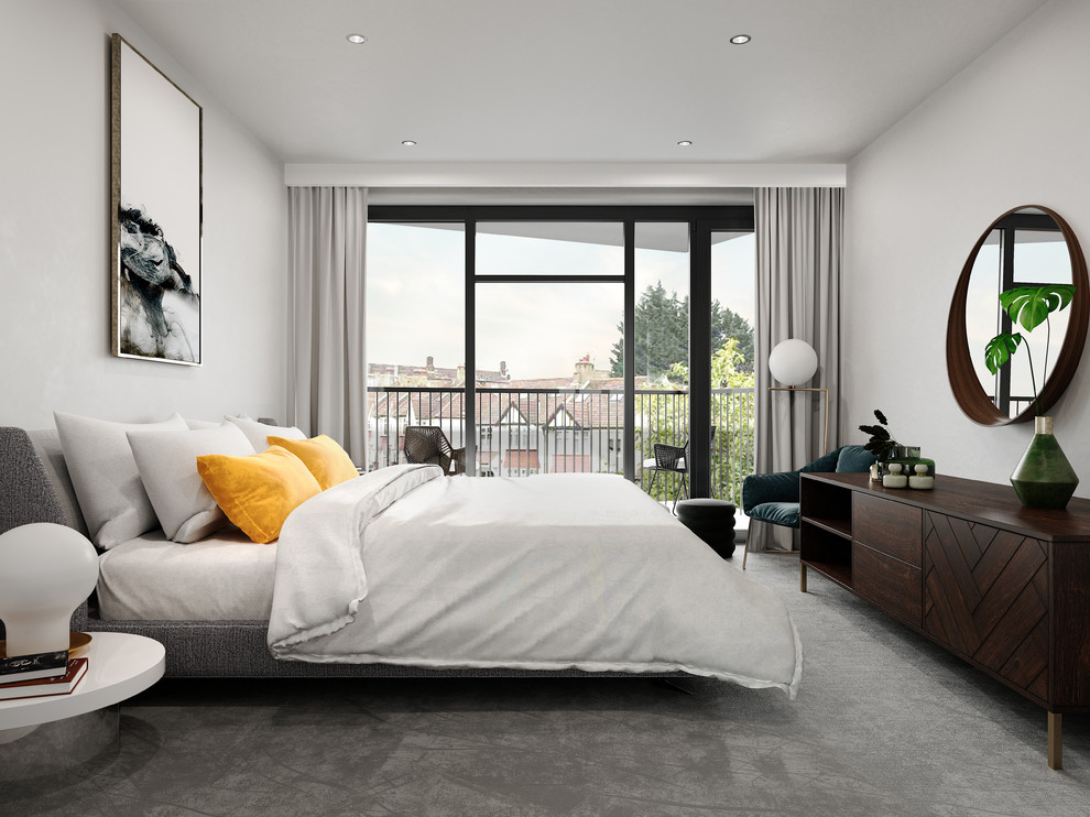 Modern inredning av ett sovrum, med vita väggar, heltäckningsmatta och grått golv