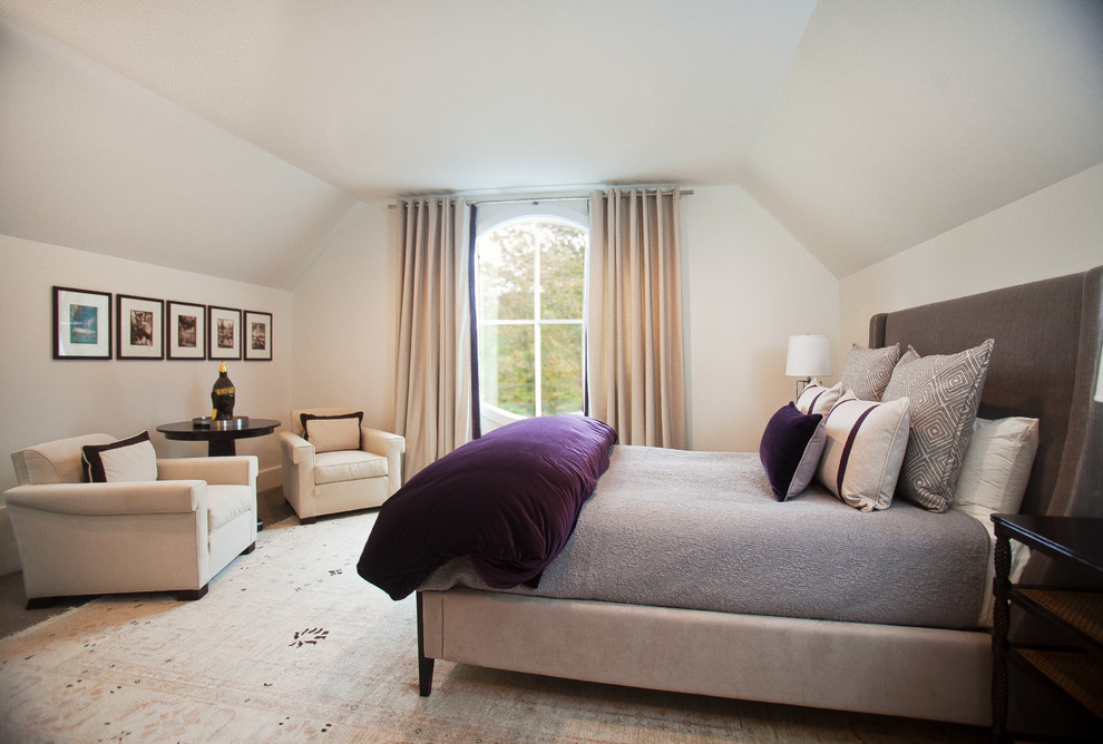 This is an example of a large contemporary master bedroom in New York with beige walls, carpet and no fireplace.