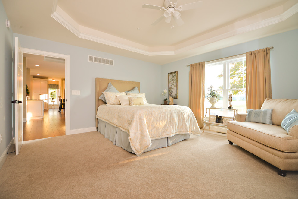 Example of a large arts and crafts master carpeted bedroom design in Other with blue walls and no fireplace