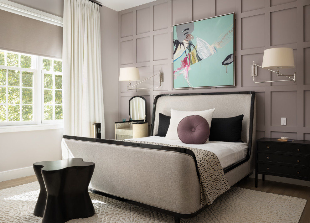This is an example of a contemporary master bedroom in New York with purple walls.