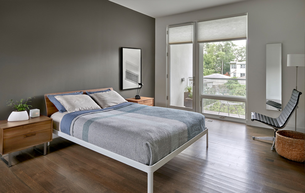 Example of a mid-sized minimalist master medium tone wood floor and brown floor bedroom design in Chicago with gray walls and no fireplace