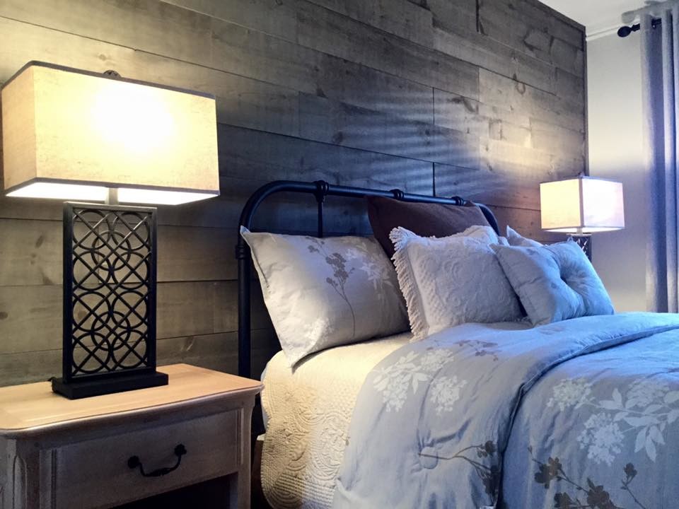 Inspiration for a medium sized rustic master bedroom in Montreal with white walls.
