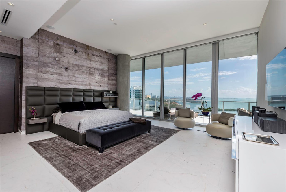 Design ideas for a medium sized contemporary master bedroom in Miami with grey walls, marble flooring and white floors.