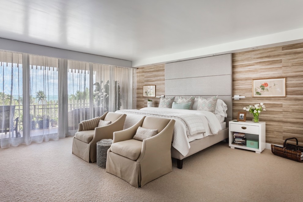 Contemporary master bedroom in Miami with beige walls, carpet and beige floors.