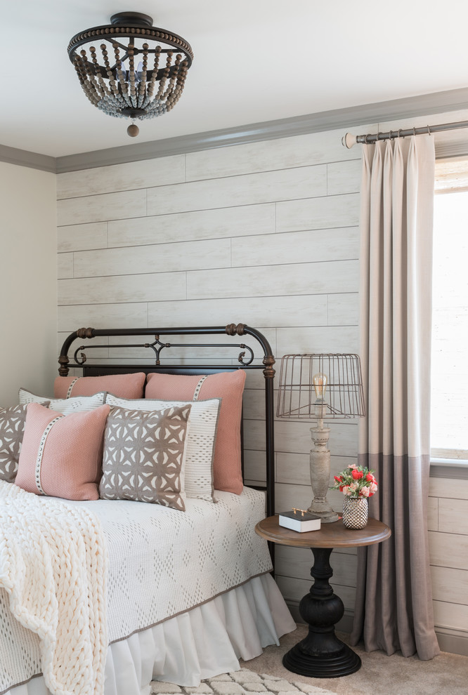 This is an example of a medium sized farmhouse guest bedroom in Other with white walls, carpet and grey floors.