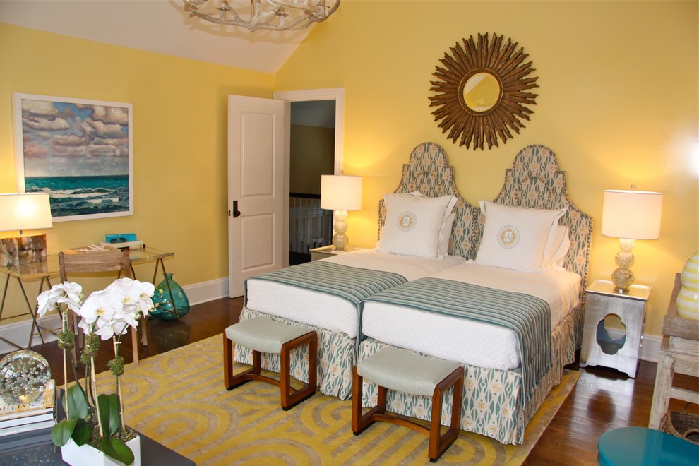 Eclectic dark wood floor bedroom photo in New York with yellow walls