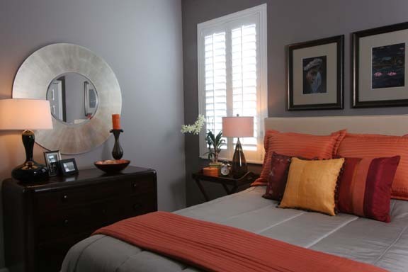 Mid-sized eclectic master bedroom photo in Orlando with gray walls and no fireplace