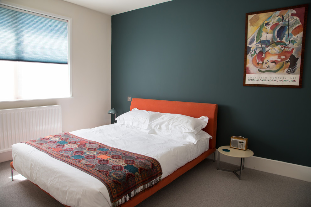 Photo of a contemporary guest bedroom in Other with blue walls.
