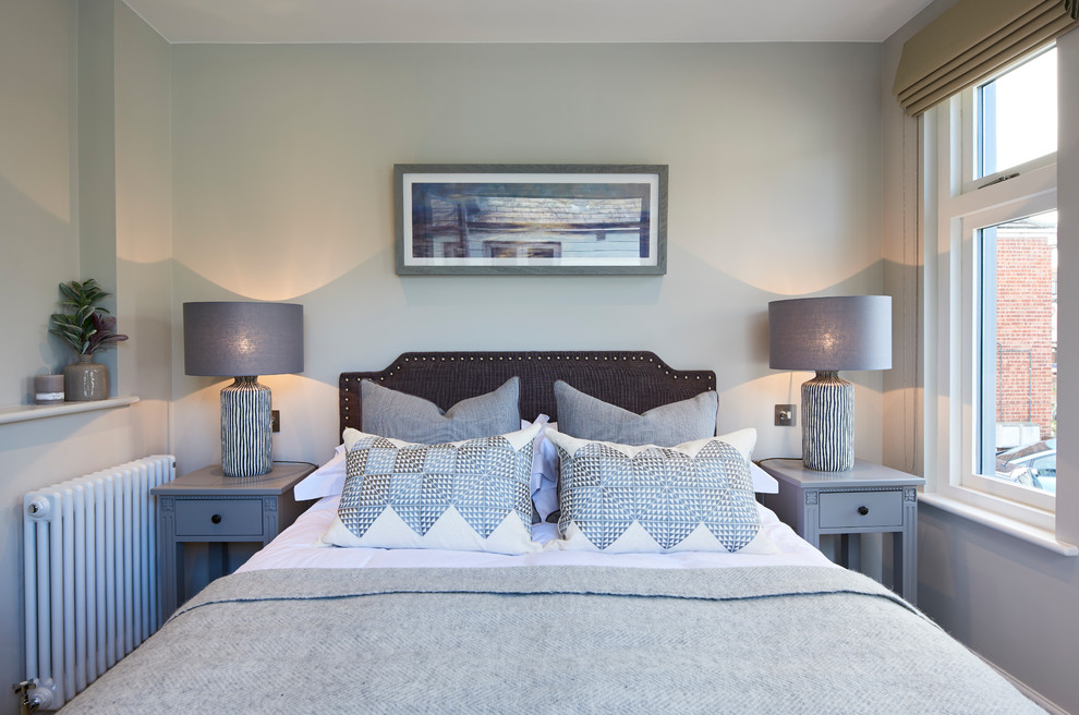 Inspiration for a transitional bedroom remodel in Hertfordshire with blue walls