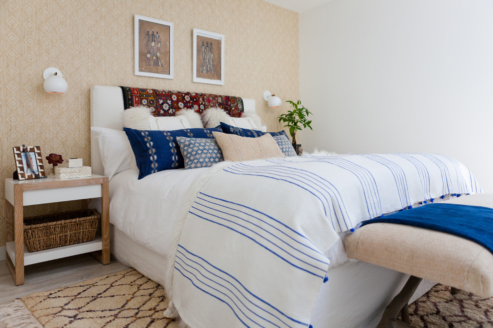 Photo of a medium sized nautical guest bedroom in Los Angeles with white walls, light hardwood flooring and no fireplace.