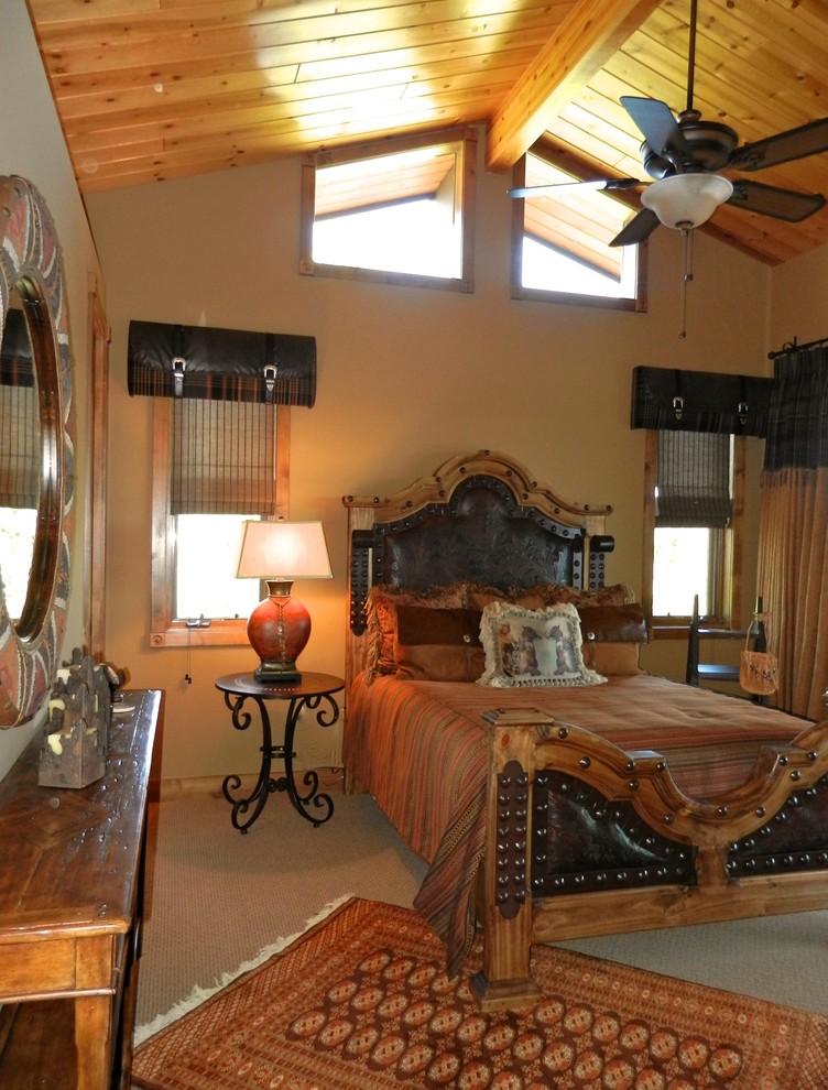 Photo of a medium sized rustic guest bedroom in Phoenix with beige walls and carpet.