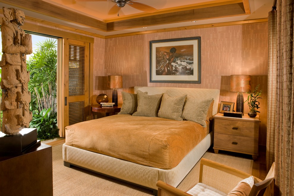This is an example of a world-inspired bedroom in Hawaii with beige walls.