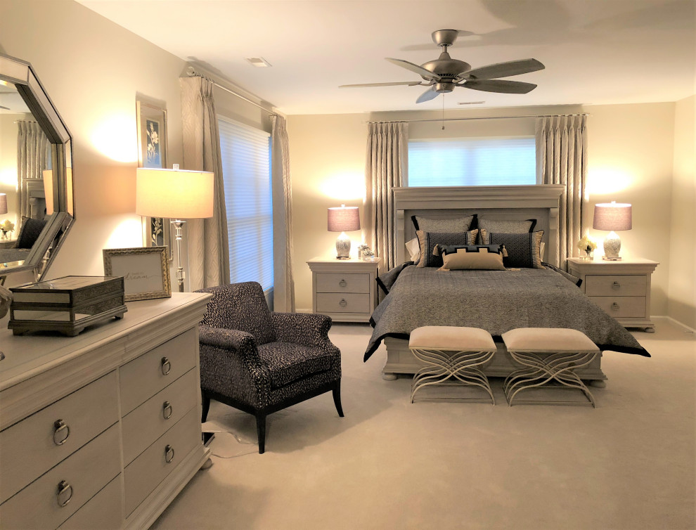 Inspiration for a large transitional guest carpeted and beige floor bedroom remodel in New York with beige walls