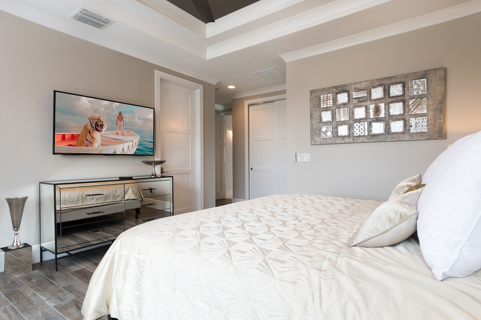 This is an example of a large traditional guest bedroom in Orlando with brown walls, porcelain flooring and no fireplace.