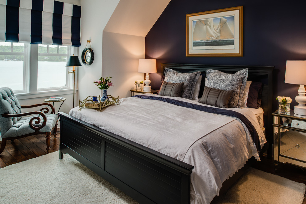 This is an example of a nautical bedroom in Detroit with black walls and dark hardwood flooring.