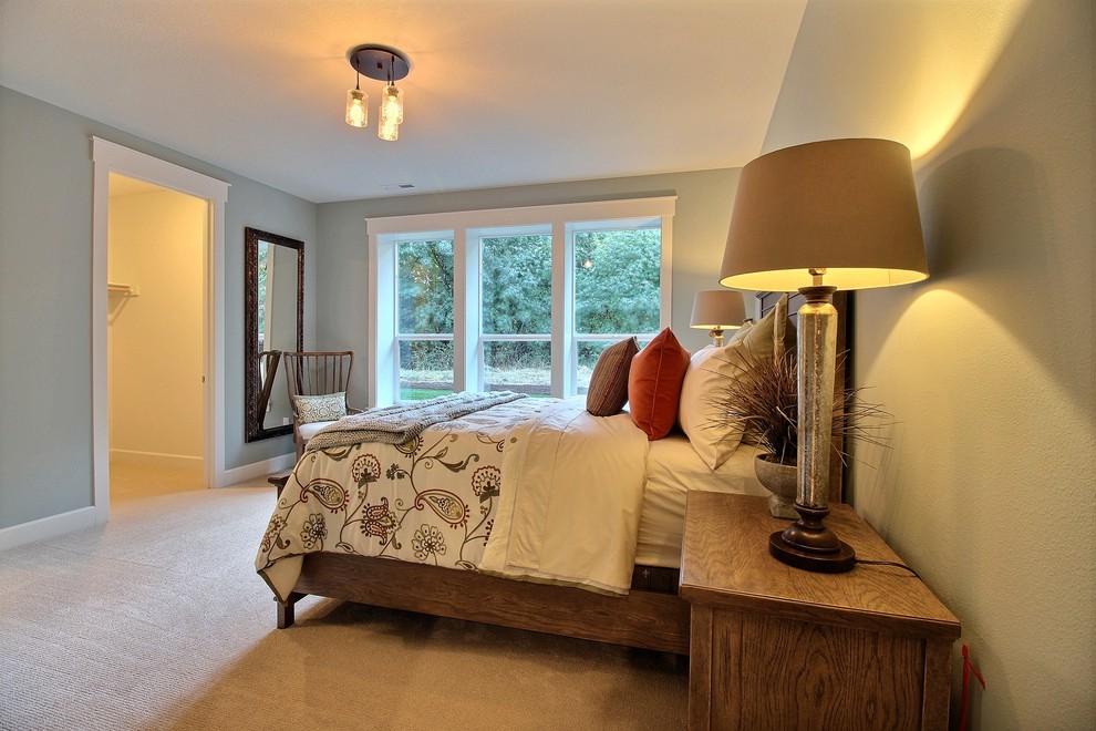 Example of a large classic guest carpeted and beige floor bedroom design in Portland with green walls and no fireplace
