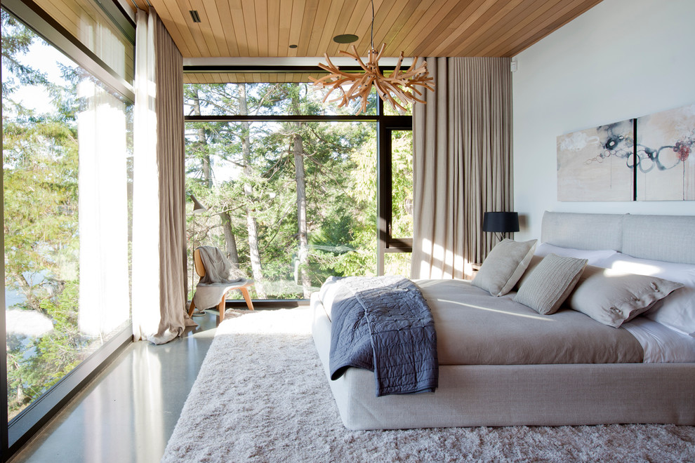 Свежая идея для дизайна: спальня в современном стиле с белыми стенами и бетонным полом - отличное фото интерьера