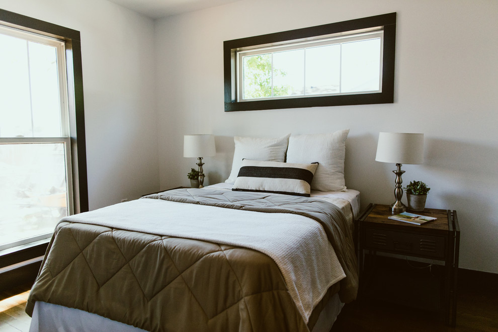 На фото: хозяйская, серо-белая спальня в стиле модернизм с белыми стенами, темным паркетным полом, коричневым полом, сводчатым потолком и стенами из вагонки
