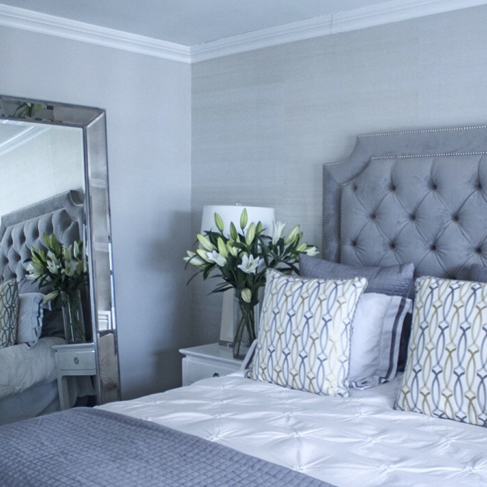 Example of a large transitional master bedroom design in Miami with gray walls