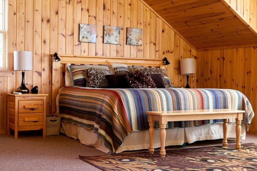 Bedroom - rustic bedroom idea in Other