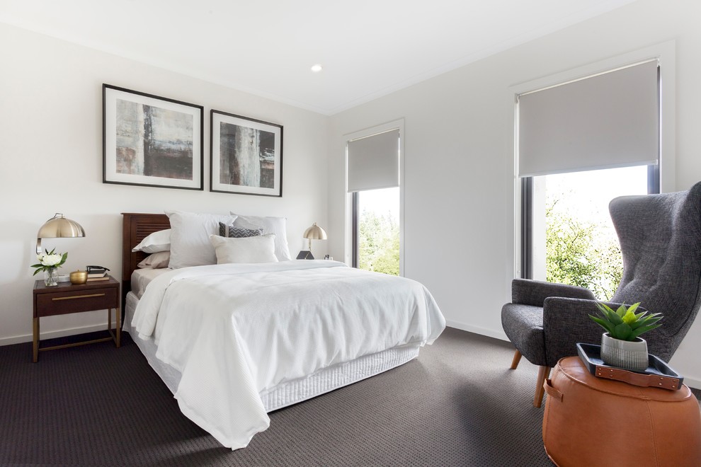 Immagine di una camera da letto minimal con pareti bianche, moquette e pavimento grigio