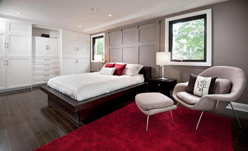 Example of a large trendy dark wood floor bedroom design in Toronto with gray walls and no fireplace