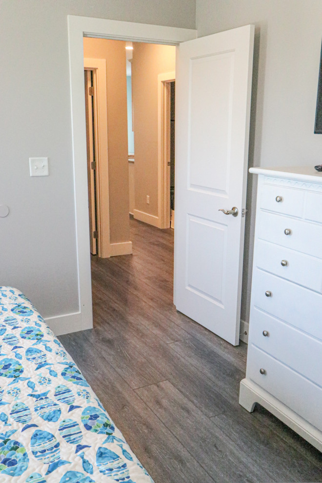 Bedroom - mid-sized coastal guest vinyl floor and gray floor bedroom idea in Miami with gray walls