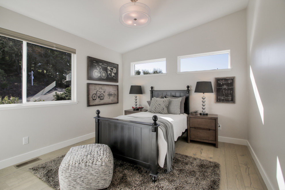 Design ideas for a classic guest and grey and silver bedroom in San Francisco with white walls, light hardwood flooring, no fireplace and beige floors.