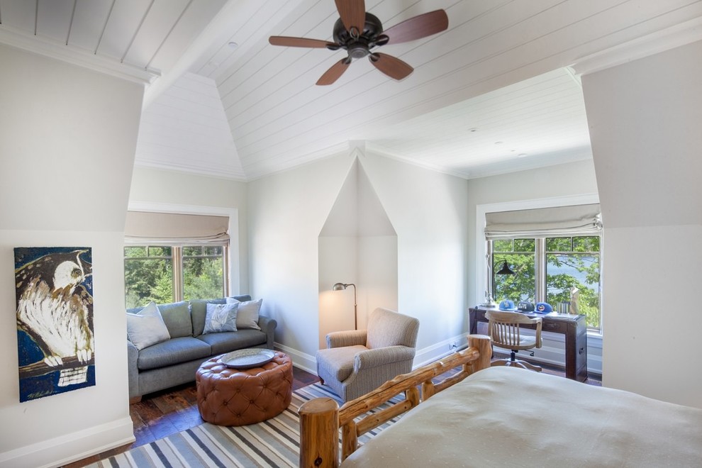 Example of a large classic guest dark wood floor and brown floor bedroom design in Toronto with white walls